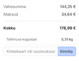 Ostukorvis olev Ryobi aku ja laadija kingitus.